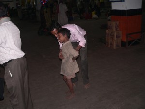 Bijoy with a street child